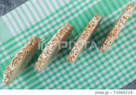 Dietary round rice cakes on striped tablecloth 73068228