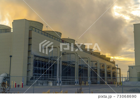 Power Plant emitting steam in Utah at sunset 73068690