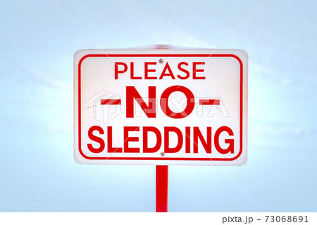 Please No Sledding sign against snow in winter 73068691