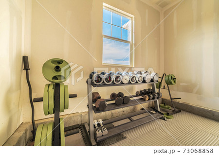 Selection of free weights for weightlifting in garage Selection of free weights for weightlifting in garage 73068858