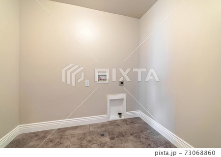 Empty laundry room with water connections empty room Empty laundry room with water connections empty room 73068860