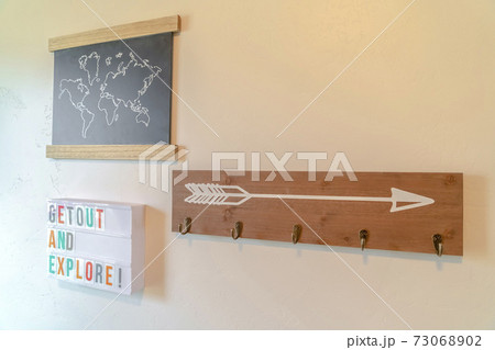 Inspirational adventure coat rack on home wall 73068902