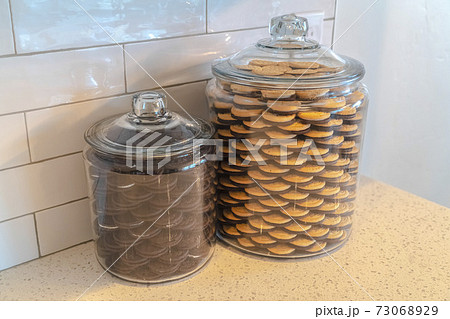 Glass storage jars filled with cookies in kitchen Stock Photo - Alamy