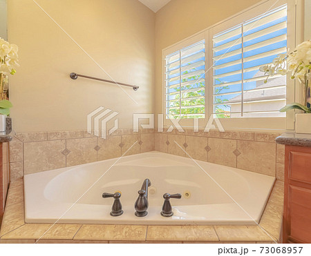 Spa bath with window light in contemporary home 73068957