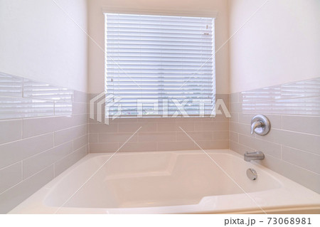 Compact bathroom interior with fitted bath with tile Compact bathroom interior with fitted bath with tile 73068981