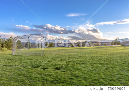 Goalposts on a green grassy sports field 73069003