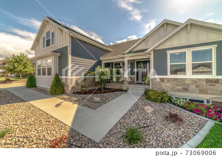 Neat front entrance to a house with pebbles 73069006