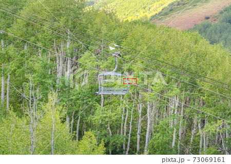 Scenic view of trees and hiking trails from a chairlift at Park City off season Scenic view of trees and hiking trails from a chairlift at Park City off season 73069161