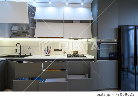 Luxury white and dark grey modern kitchen interior, front view 73069625