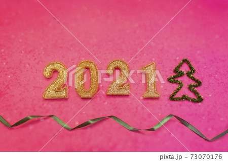 Happy new year 2021 celebration, glitter numbers on pink background, Flat lay. 73070176