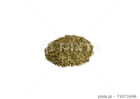 Dried leaves of yerba mate tea heap isolated Dried leaves of yerba mate tea heap isolated 73071646