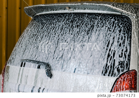 Washing the car with foam Washing the car with foam 73074173