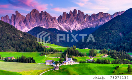 Santa Maddalena village, Dolomites mountains in background, Famous alpine place Santa Maddalena village, Val di Funes valley, Trentino Alto Adige region, Italy, Europe Santa Maddalena village, Dolomites mountains in background, Famous alpine place Santa Maddalena village, Val di Funes valley, Trentino Alto Adige region, Italy, Europe 73075152