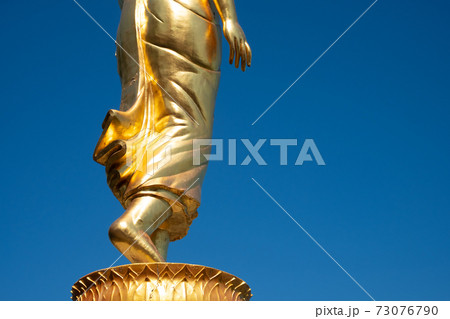 Buddha walking closeup feet statue in Thailand for the way of wisdom to nibbana or nirvana Buddha walking closeup feet statue in Thailand for the way of wisdom to nibbana or nirvana 73076790