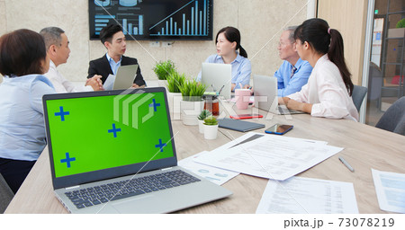 meeting with green screen laptop 73078219