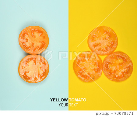 Creative layout made of yellow tomato. Food concept. 73078371