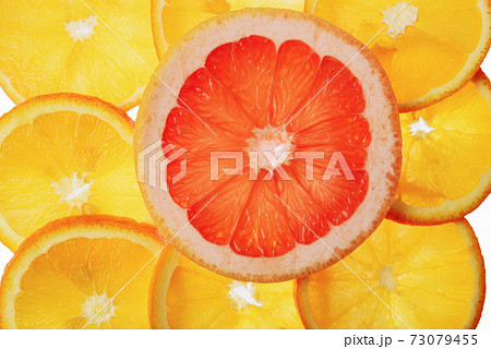 translucent orange and grapefruit slices on a white background, citrus fruit slices translucent orange and grapefruit slices on a white background, citrus fruit slices 73079455