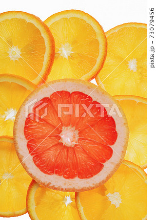 translucent orange and grapefruit slices on a white background, citrus fruit slices translucent orange and grapefruit slices on a white background, citrus fruit slices 73079456