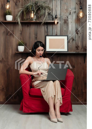 Customer service representative working from home on laptop 73080888