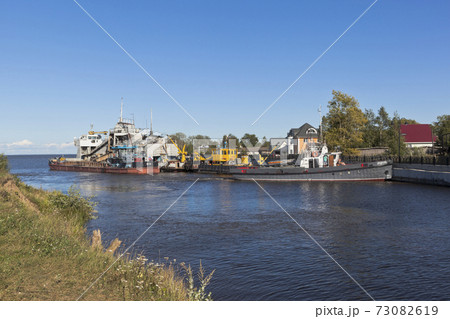 Vessels of technical fleet at the entrance to Belozersky bypass canal from the White Lake near the town of Belozersk Vologda region Vessels of technical fleet at the entrance to Belozersky bypass canal from the White Lake near the town of Belozersk Vologda region 73082619