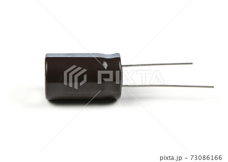 Electrolytic capacitor isolated on white Electrolytic capacitor isolated on white 73086166
