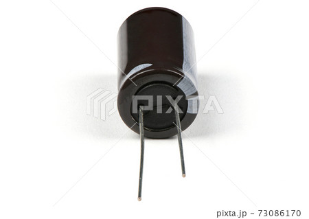 Electrolytic capacitor isolated on white Electrolytic capacitor isolated on white 73086170