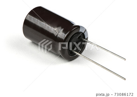 Electrolytic capacitor isolated on white Electrolytic capacitor isolated on white 73086172
