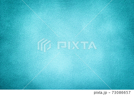 Blue matte background of suede fabric with vignette, closeup. Velvet textile. Blue matte background of suede fabric with vignette, closeup. Velvet textile. 73086657