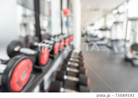 Gym blur background fitness center, workout personal training studio, health club with blurry sports exercise equipment for aerobic, bodybuilding and power strength class 73089593