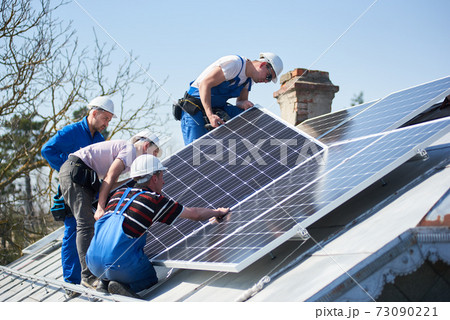 Installing solar photovoltaic panel system on roof of house Installing solar photovoltaic panel system on roof of house 73090221