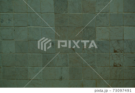 Background texture of a grey tiled wall 73097491