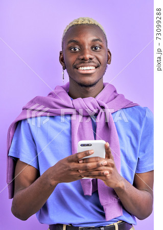 trendy afro american black man typing message to someone trendy afro american black man typing message to someone 73099288