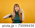 Human hand thumb down, no okay, angry face, negative gesture showing dislike 73099436