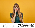 Touching mouth with hand painful expression toothache struggling dental 73099440