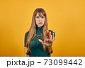 Palm arm raised air angry look straight you will not pass through facial harsh. 73099442