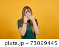 Covering mouth with palm. Can't say anything. Shocked gasping amazed stunning 73099445