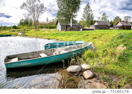 Fishing boats on the bank of the lake 73100179