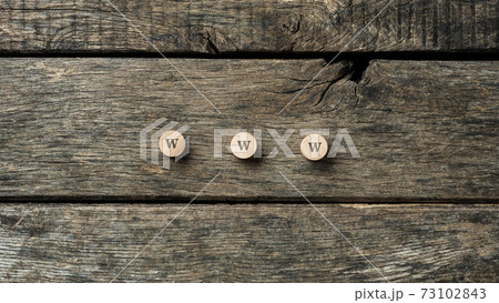 WWW sign spelled on three wooden cut circles WWW sign spelled on three wooden cut circles 73102843