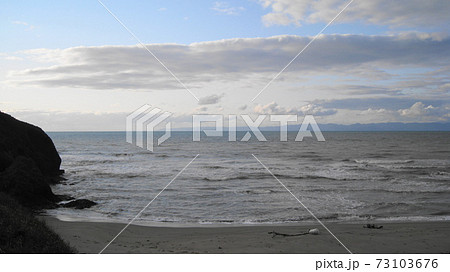 角海浜の岬と日本海と佐渡ヶ島の写真素材