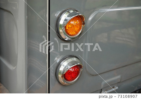Detail RED tail light and turn signal old car. classic Vintage car automobile. Detail RED tail light and turn signal old car. classic Vintage car automobile. 73108907
