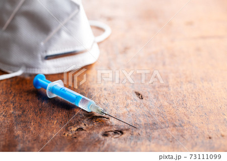 Injection syringe. Covid-19 coronavirus vaccination. Corona virus vaccine. Injection syringe. Covid-19 coronavirus vaccination. Corona virus vaccine. 73111099