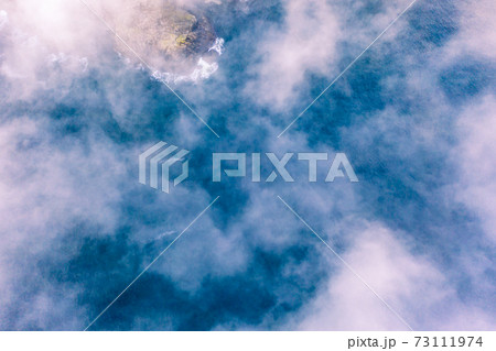 Dramatic aerial view of clouds from above at the Slieve League cliffs in County Donegal, Ireland 73111974