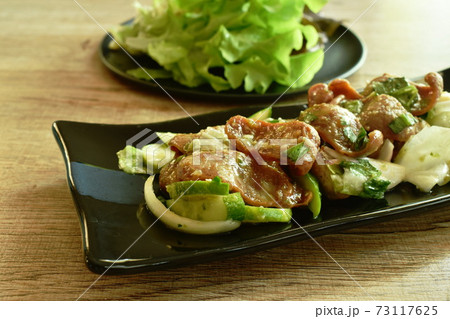 spicy slice fried Chinese pork sausage with cucumber and shallot Thai salad eat couple fresh vegetable on plate spicy slice fried Chinese pork sausage with cucumber and shallot Thai salad eat couple fresh vegetable on plate 73117625
