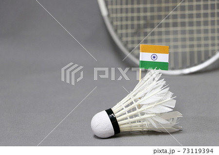 Mini India flag stick on the white shuttlecock on the grey background Mini India flag stick on the white shuttlecock on the grey background 73119394