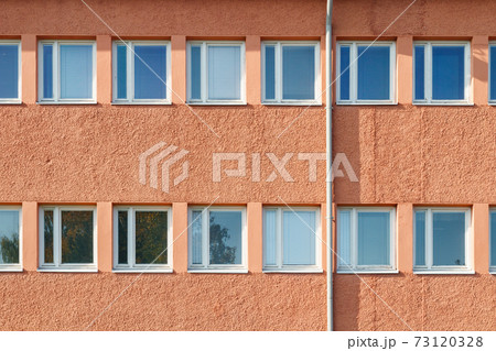 Facade of a building with rows of windows Facade of a building with rows of windows 73120328