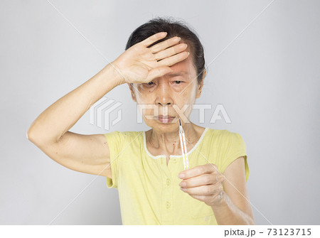 old asian woman feel have fever and sick 73123715