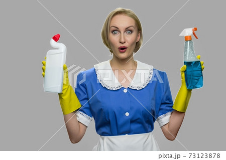 Portrait of shocked house maid looking at camera. Portrait of shocked house maid looking at camera. 73123878