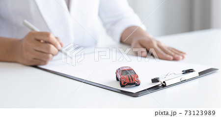 Car dealers or insurance managers cover and protect against damage and the risk of driving, Protecting and after-sales care concept. Car dealers or insurance managers cover and protect against damage and the risk of driving, Protecting and after-sales care concept. 73123989