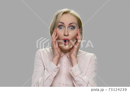 Young pretty woman with shocked expression. Young pretty woman with shocked expression. 73124239