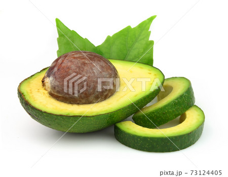 Avocado nuts with leaves on white backgrounds 73124405